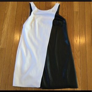 Dress size medium faux leather- one side faux leather- the other side white.